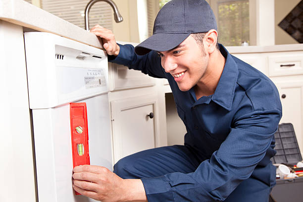 istock Plumber working on dishwasher in domestic kitchen 171589113