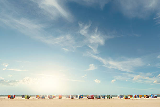 Beach chairs Beachchairs on the beach with a huge sky north sea photos stock pictures, royalty-free photos & images