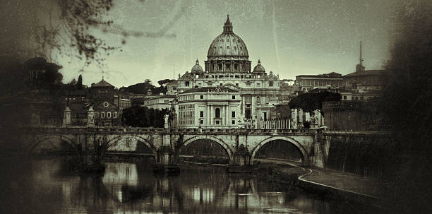 View on the Tiber river  and Michelangelo's Saint Peter basilica in the background, in Rome Aged and black and white old style picture.