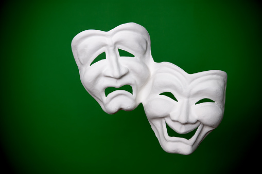 theater masks on green
