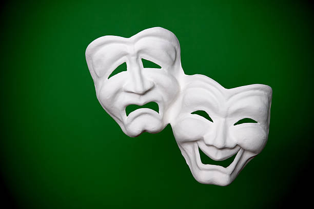 theater masks theater masks on green tragedy mask stock pictures, royalty-free photos & images