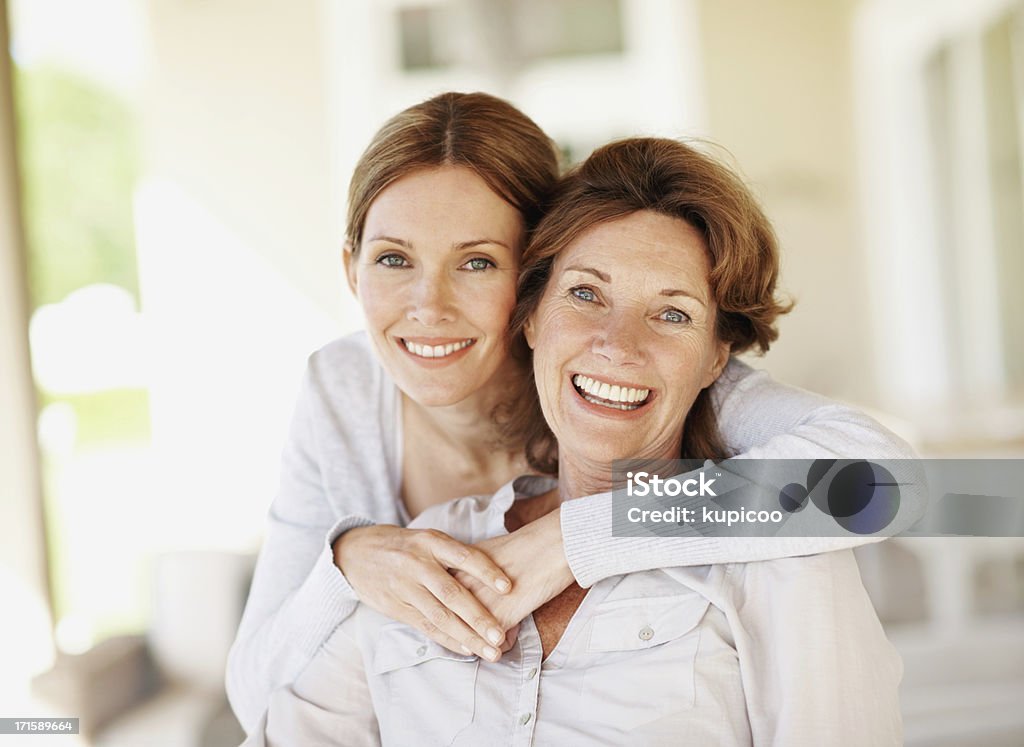 Positivity runs in their family Smiling mother with her beautiful adult daughter - portrait Daughter Stock Photo