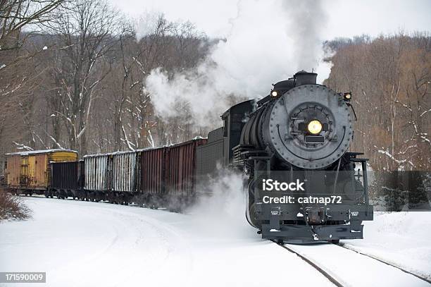 Steam Locomotive Pulling Train In Winter Snow Rounding Curve Stock Photo - Download Image Now