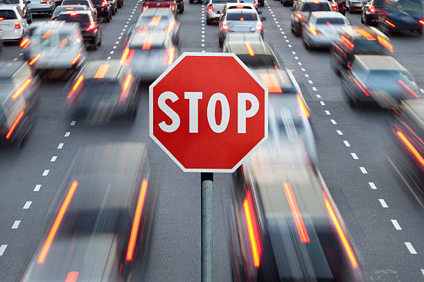 istock Stop sign and cars at rush hour 171590144