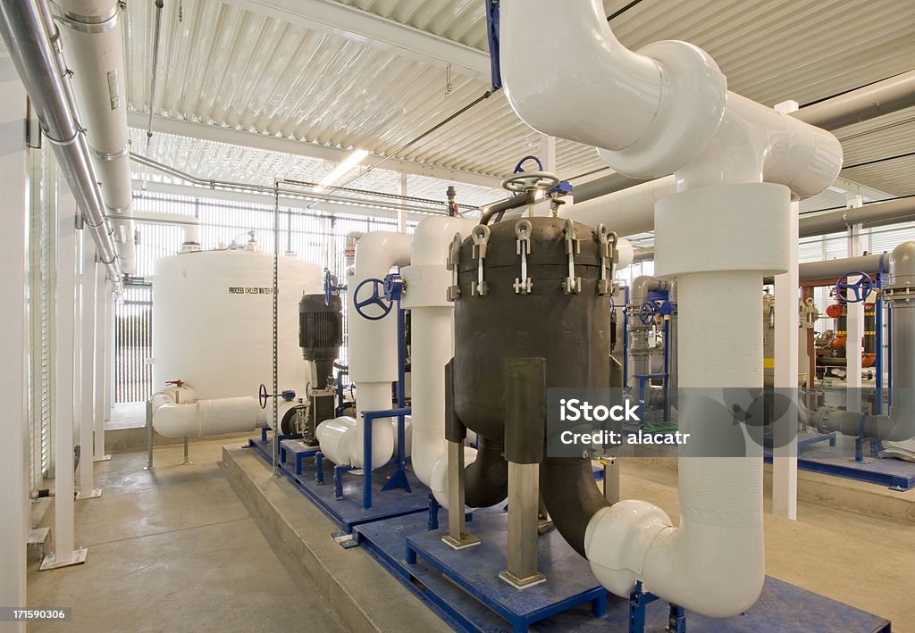 Pumps, Filters and Storage Tank for HVAC Cooling System Pipes and filtration for a water based cooling system used in industrial hi-tech manufacturing.Click on any of the thumbnails below to see more images in my HVAC lightbox. Industry Stock Photo