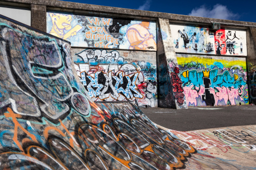 Skate park with Graffiti at launceston Tasmania.The local Council allows graffiti art at the skate board park.The Graffiti art here is always changing, and new graffiti is being painted over very often by local teenagers and skaters as they like, without being chased off by the law/Police.