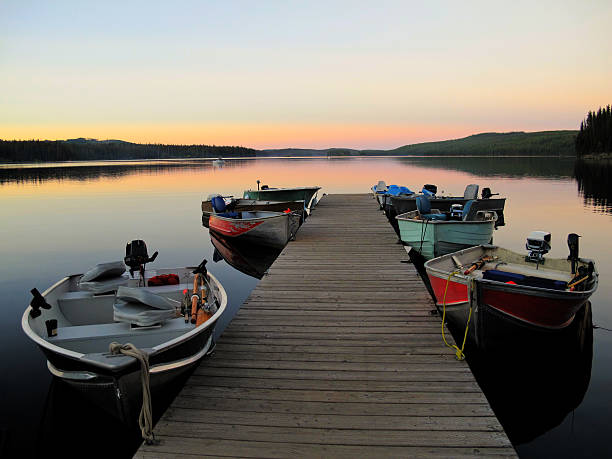 istock Fishing boats line dock at sunset 171590509