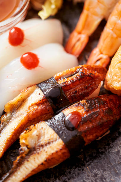 istock Eel sushi and squid sushi on a plate 1715905732