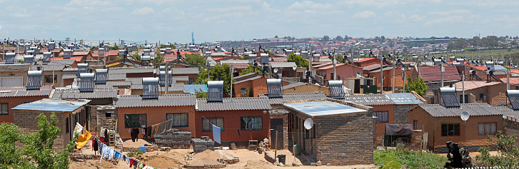 Alexander Township in Johannesburg, South Africa, showing new low cost homes fitted with Solar Power for hot water geysers.