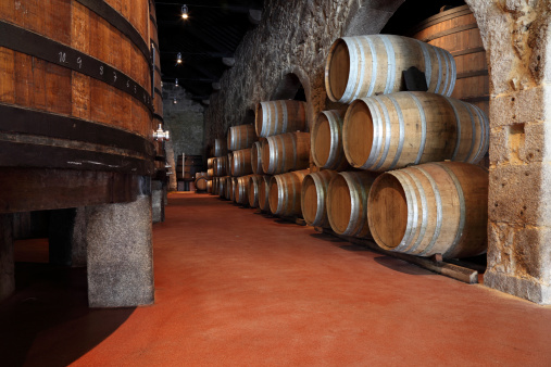 Old fashioned Porto wine cellar with wooden barrels in Porto, Portugal