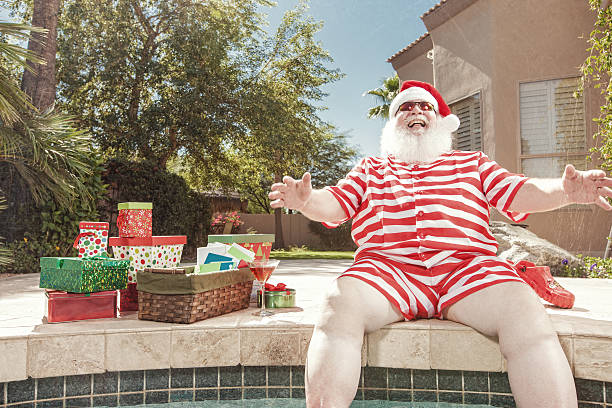 istock Real Santa Laughing by the Pool in Summer 171590960