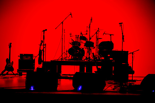 Live music and concert background. Guitarist and drummer and singer.Night entertainment and festival events.