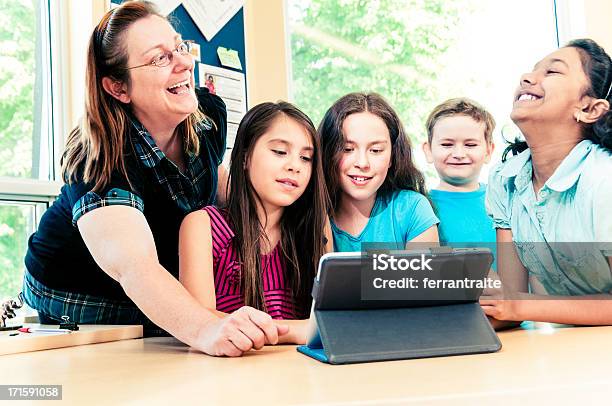 Tablet Pc Fun At School Stock Photo - Download Image Now - Teacher, Bonding, High School Student