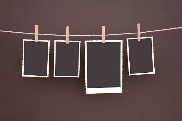 istock old blank photos hanging on clothesline with clipping path 171591348