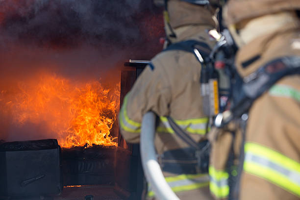 istock Fireman putting out a living fire 171591373