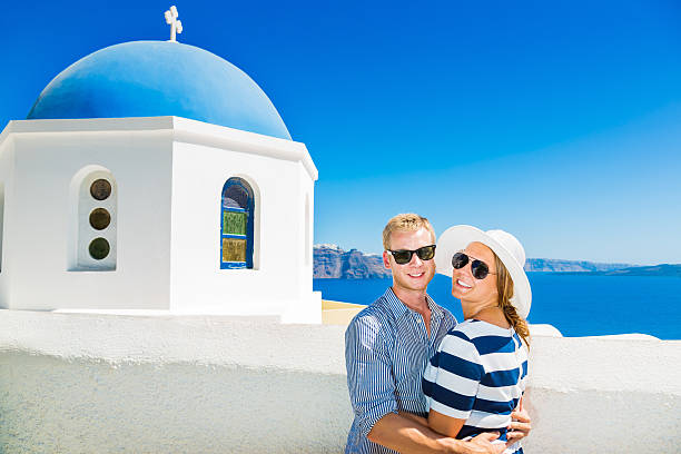 istock Happy young couple on Santorini island, Greece 171591559