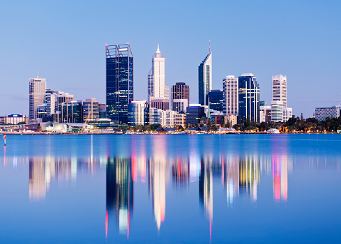 The Perth city skyline at twilight with reflection, viewed across the Swan River, Western Australia.