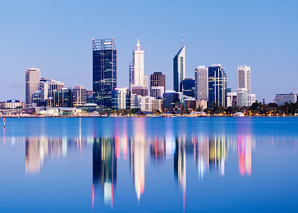 Perth City Skyline at Night Australia The Perth city skyline at twilight with reflection, viewed across the Swan River, Western Australia. perth australia photos stock pictures, royalty-free photos & images
