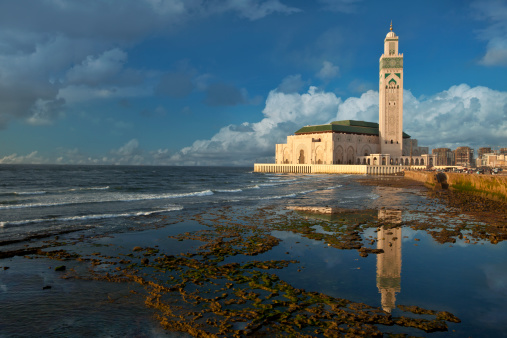 The Hassan II Mosque is a mosque in Casablanca, Morocco. It is the largest mosque in the country and the 7th largest mosque in the world. Its minaret is the world's tallest at 210 m (689 ft).It stands on a promontory looking out to the Atlantic Ocean. A total of 105,000 worshippers can gather for prayer at the mosque simultaneously, 25,000 inside the mosque and another 80,000 on the mosque's ground outside.OTHER MOROCCO PHOTOS