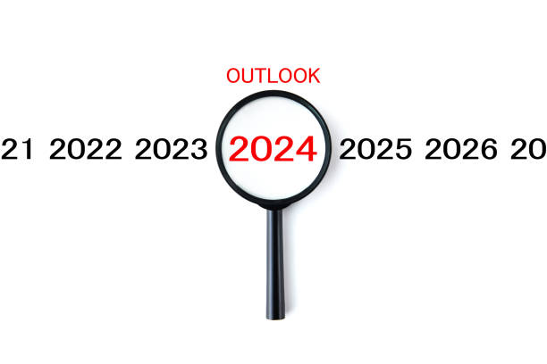 istock Magnifying glass and annual number 2024 with OUTLOOK word 1715940613