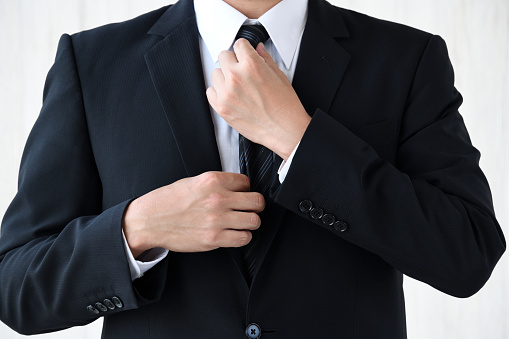 Business man wearing tie with no face