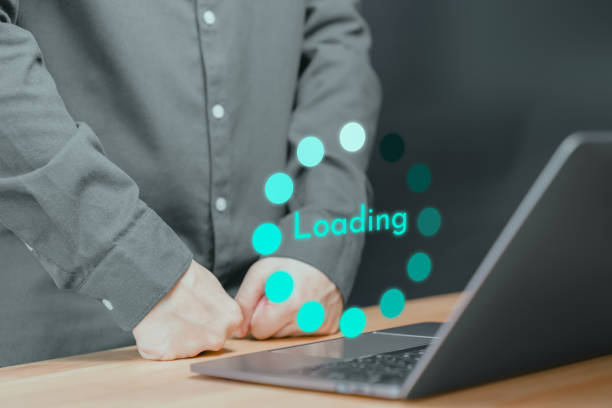 istock User use a laptop computer to download and update software with waiting to load digital file data from the website, and very slow internet from wifi. Concept of waiting for a load of loading symbol. 1715993588