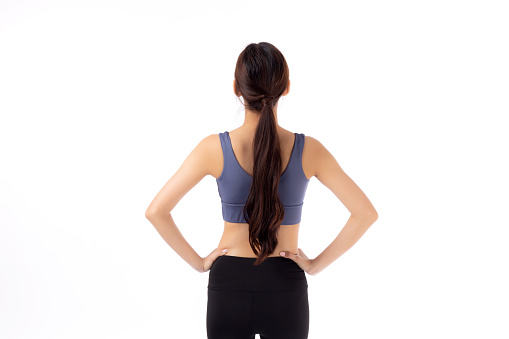 Portrait of beautiful young asian woman in sportswear showing waist and abs isolated on white background, sport and exercise for health, female slimming with confident and wellness, back view.