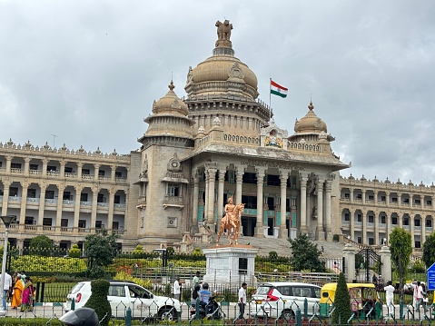 Bangalore,Karnataka,India-September 30, 2023: Exclusive day shots of Vidhana Soudha building with traffic on a overcast day