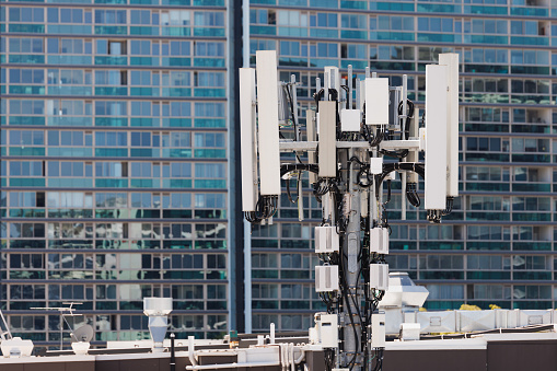 5G Network Communications Tower On City Rooftop