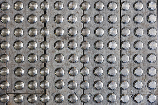 Anti-slip tactile studs on concrete footpath