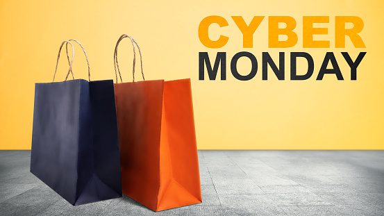 Shopping bags with a colored background. Cyber Monday concept