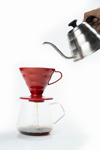Serves coffee with a V60 dripper coffee maker on a white background