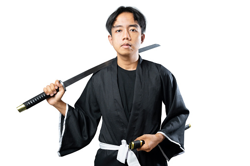 Samurai warrior holding the sword isolated over white background