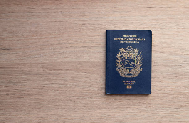 istock Venezuelan passport with dollars 1716233638