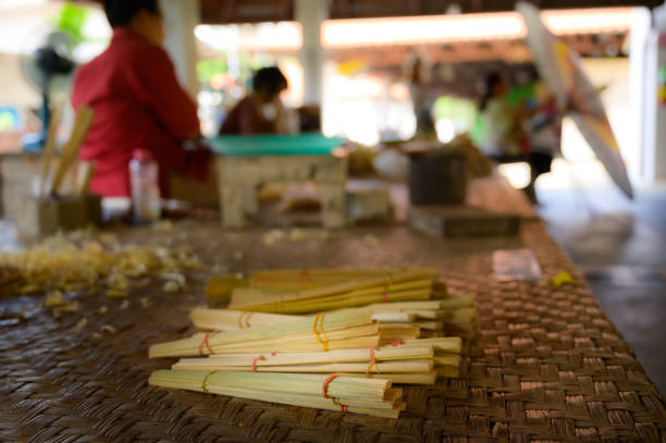 Bamboo is prepared for use in making Lanna style fans, Chiang Mai Province.