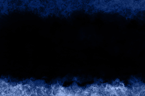 Dark blue black coloured monochrome backdrop with spooky scary halloween fog, smoke theme midnight scene. There is no people and no text bot ample copy space.