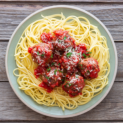 Spaghetti with meatball on white with clip path.  Please see my portfolio for other food and drink images.