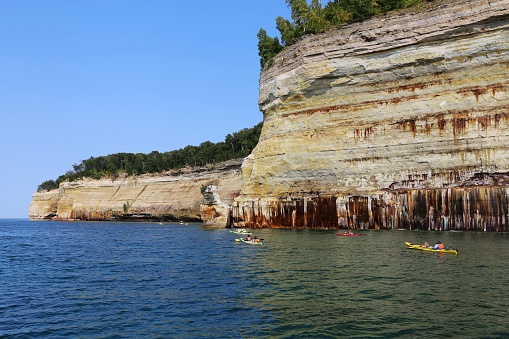 Colorful sandstone cliffs and formations at Pictured Rocks National Lakeshore of Lake Superior, Munising, Michigan, USA