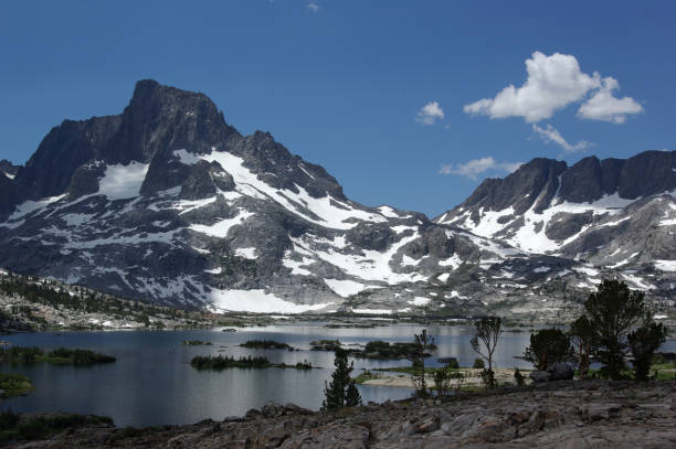 istock Rocky Mountain Dominating a Lake with Small Islands 1716341351