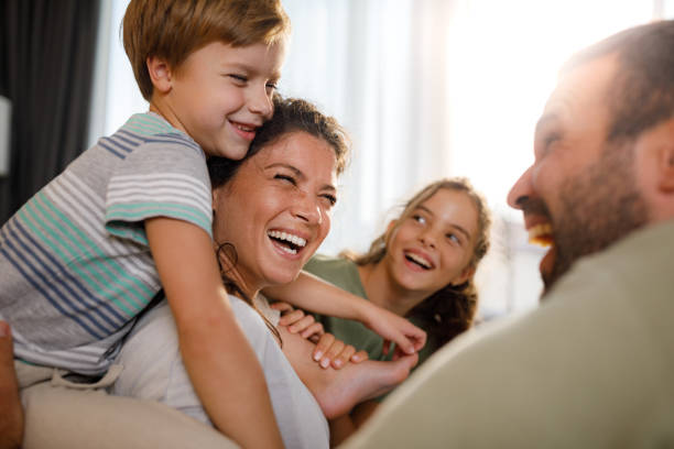 istock Cheerful family having fun while talking at home. 1716344627