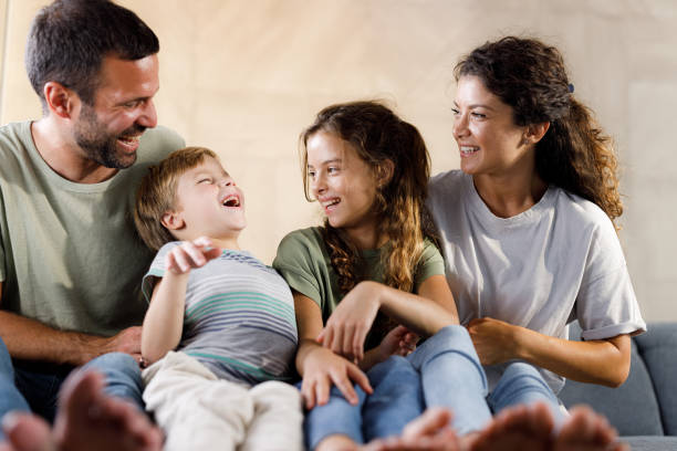 istock Playful parents having fun with their small kids at home. 1716354710