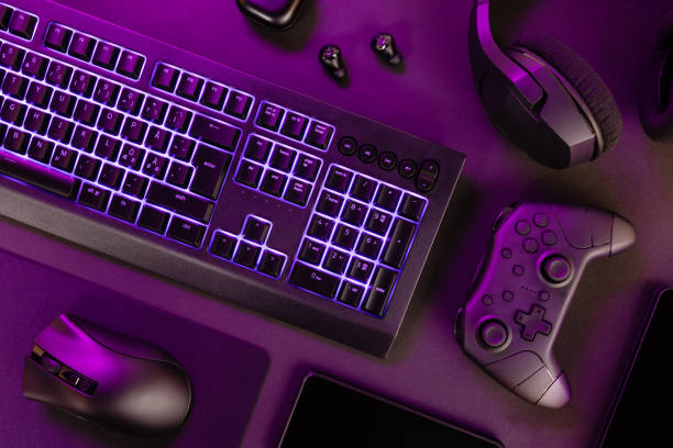 istock Purple lit keyboard amidst wireless devices 1716355534