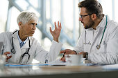 Frustrated doctors arguing on a meeting in hospital.