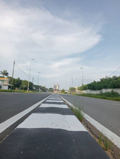 istock Black and white painted line on the street 1716366943