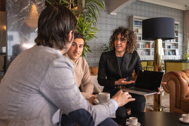 istock Colleagues using laptop for a presentation during a business meeting 1716375754