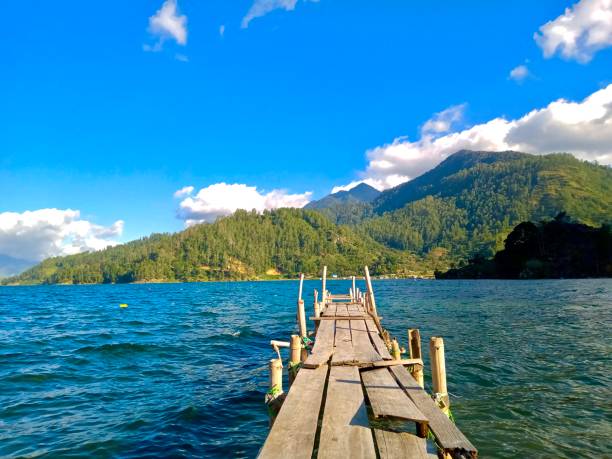 istock Lake in the morning at pier 1716377362