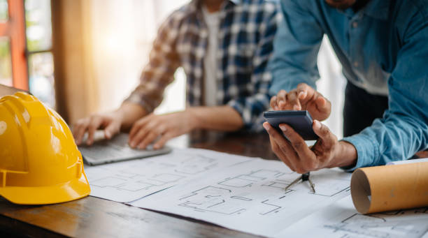 istock Engineer Teamwork Meeting, Drawing working on blueprint meeting for project working with partner on model building at company office. 1716380563