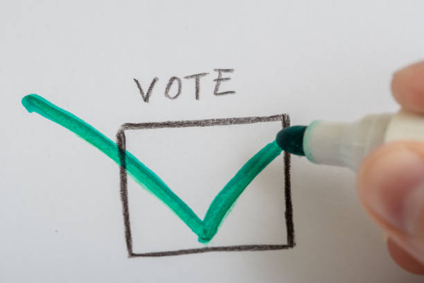 istock Cast your vote and check the box next to the selected candidate 1716421007