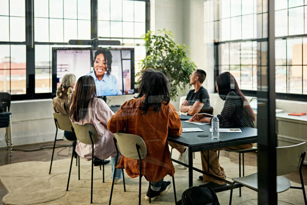 istock Business team meeting photographed through window 1716437310