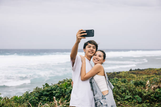istock Japanese couple taking a selfie with the view 1716460245